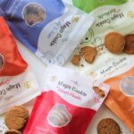 PawCo Magic Cookies in five functional flavors: Gut Health, Heart Health, Hip & Joint, Skin & Coat, and Original. Crafted with clean, plant-based ingredients for healthier, happier dogs. Image source: PawCo